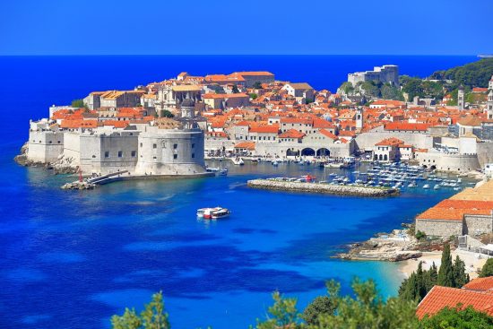 Dubrovnik's old town surrounded by fortified walls above the Adriatic sea.