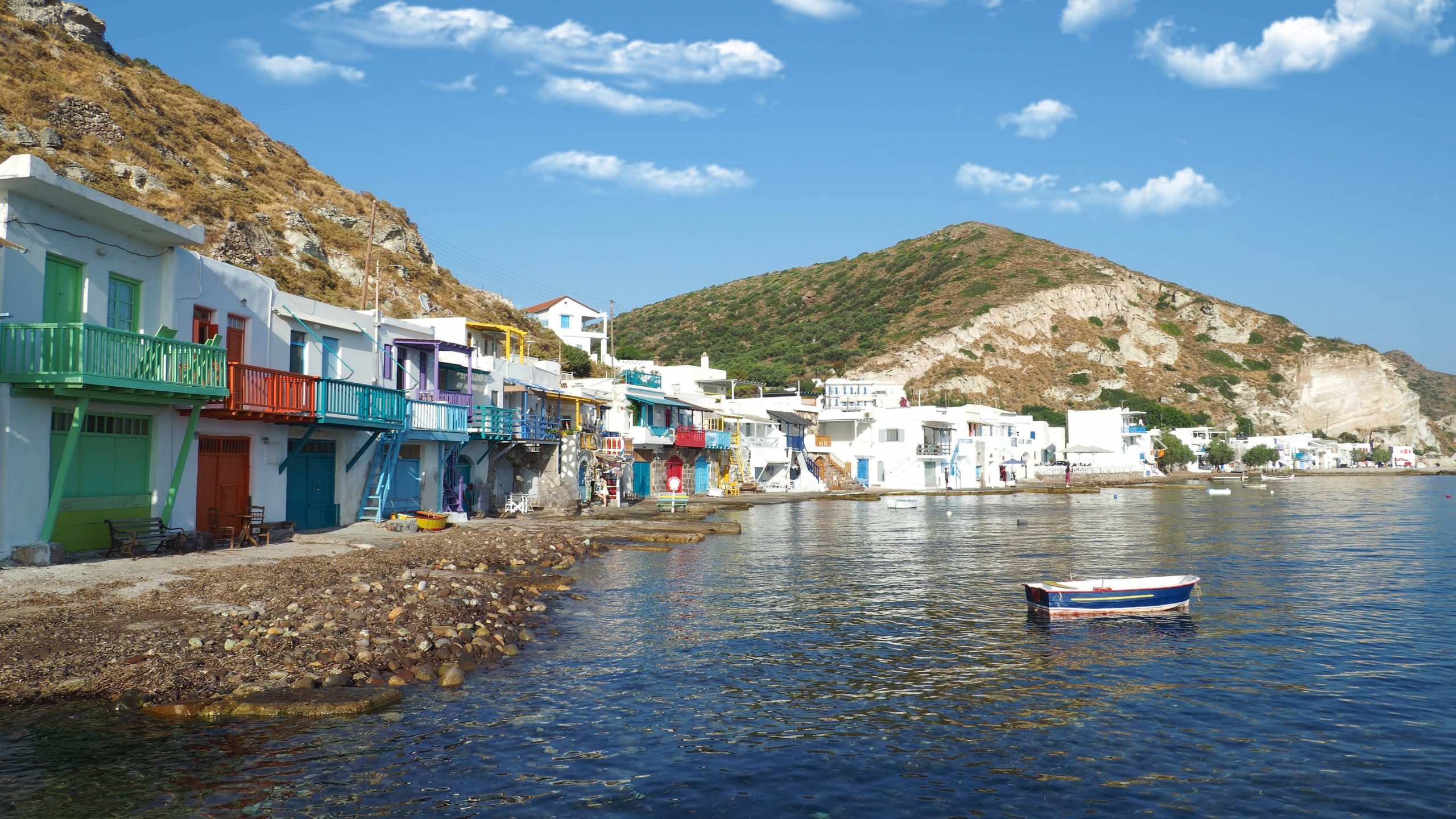 Beautiful fishermen scenic seaside picturesque village of Klima in entrance of port of Adamantas with colourful boat houses called Syrmata, Milos